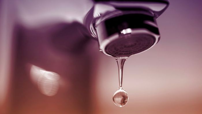 Close-up of a dripping faucet