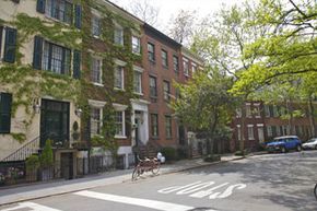 A row of apartment complexes along a street.