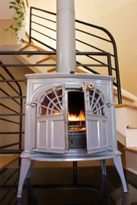 A modern condo with a wood stove in action