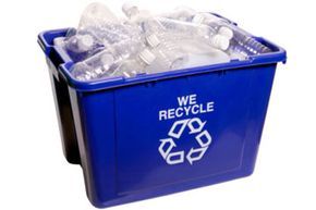 A recycling bin filled with bottles