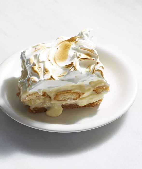 Banana pudding pie bars topped with a fluffy meringue layer.