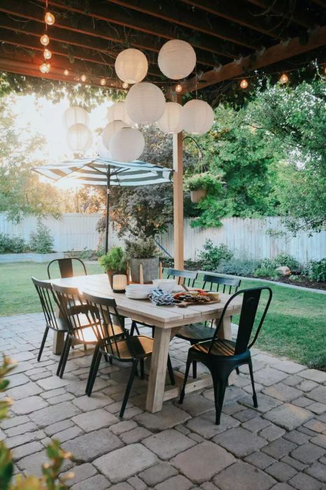 hanging paper lanterns and string lights in the backyard