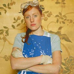 A woman donning a sturdy, heavy-duty apron