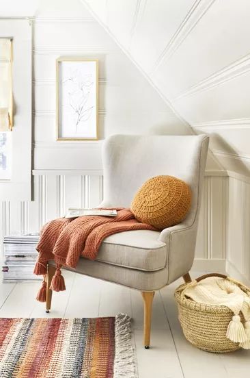 A room featuring accents of rust and mustard