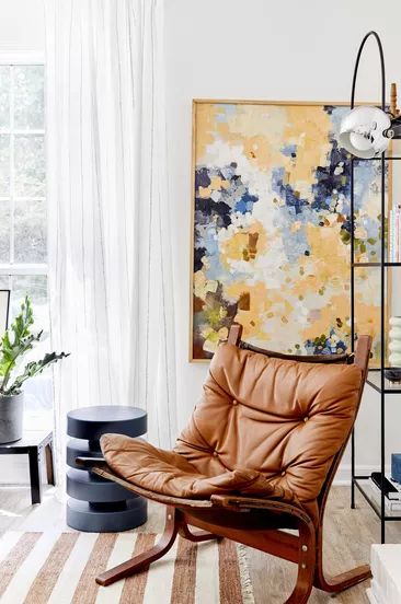 A living room adorned with brown and mustard accents