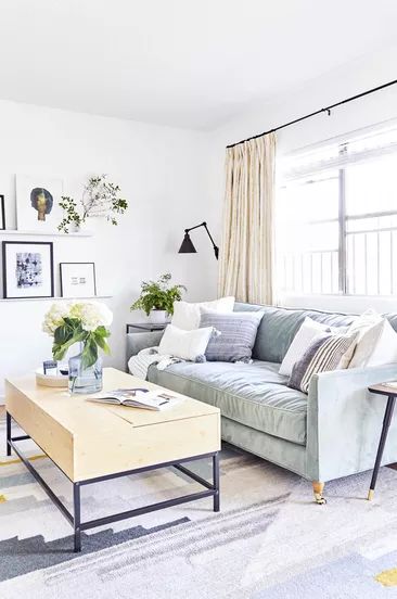A living room featuring light purple and gray accents