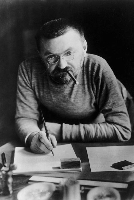Charles Steinmetz works on a paper.