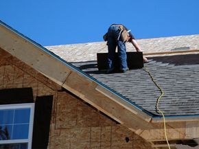 A roofer working on a new roofing installation.