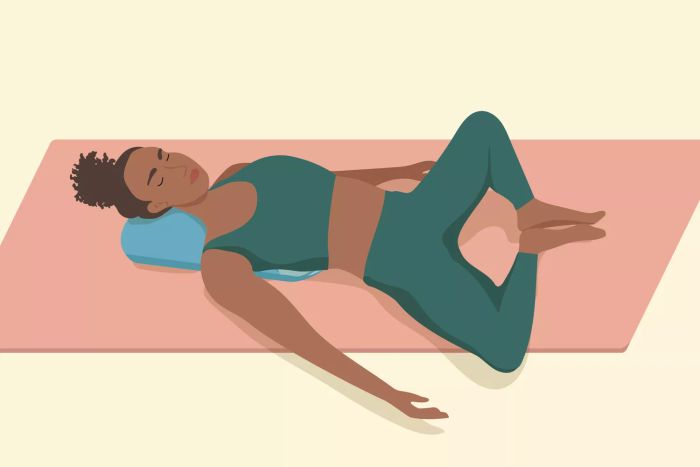 Stress-relieving yoga pose: reclining bound angle pose with a bolster