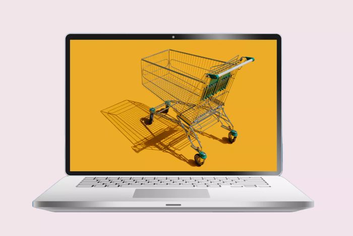 Laptop displaying a shopping cart on the screen