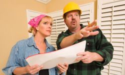 woman talking with contractor about renovation plans