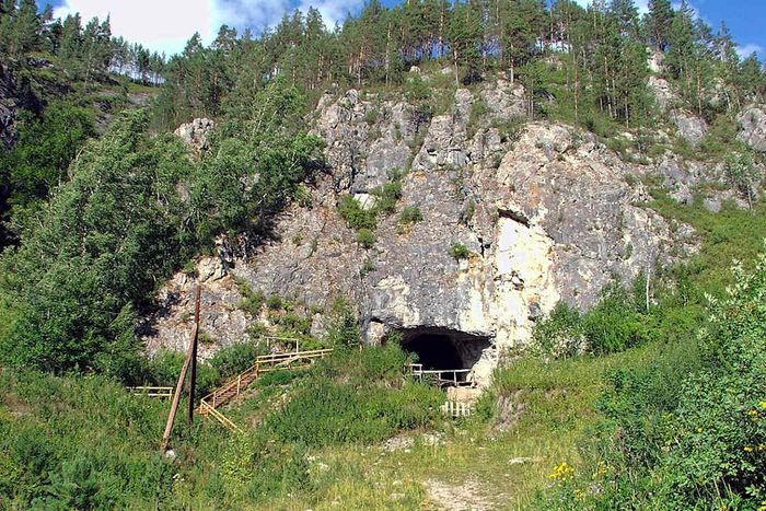 The entrance to Denisova Cave, located in Russia’s Altai Mountains.