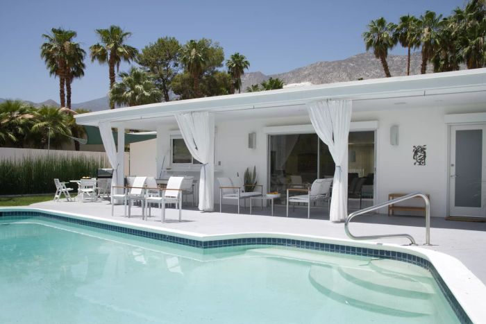 Mid-century modern home with a pool in the backyard