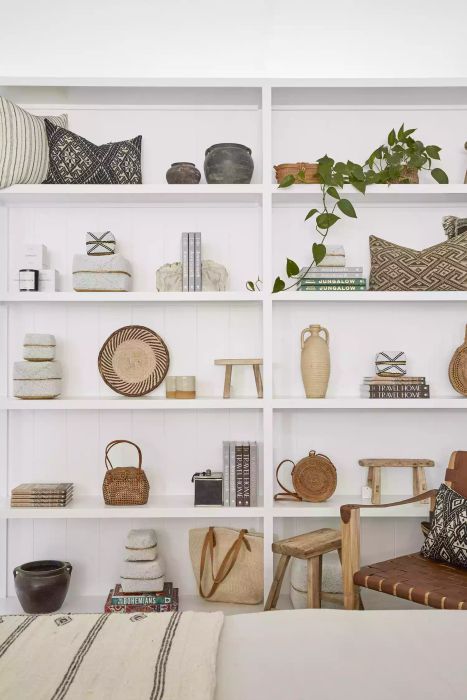 White shelves adorned with sleek, neutral decor