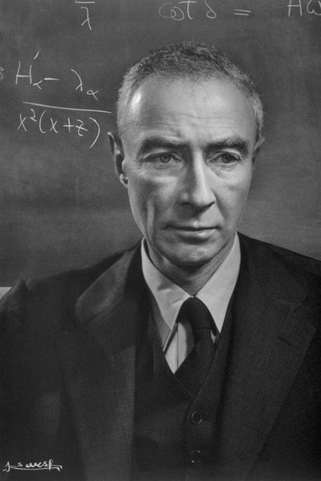 J. Robert Oppenheimer Standing Next to a Blackboard