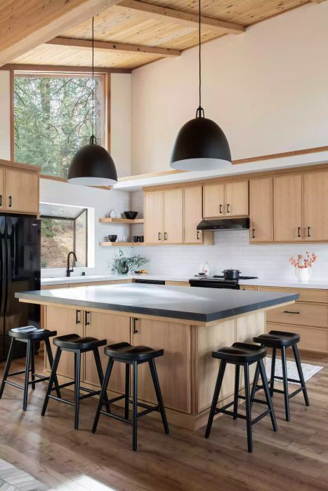 Neutral kitchen with white walls, oak cabinets, and black accents