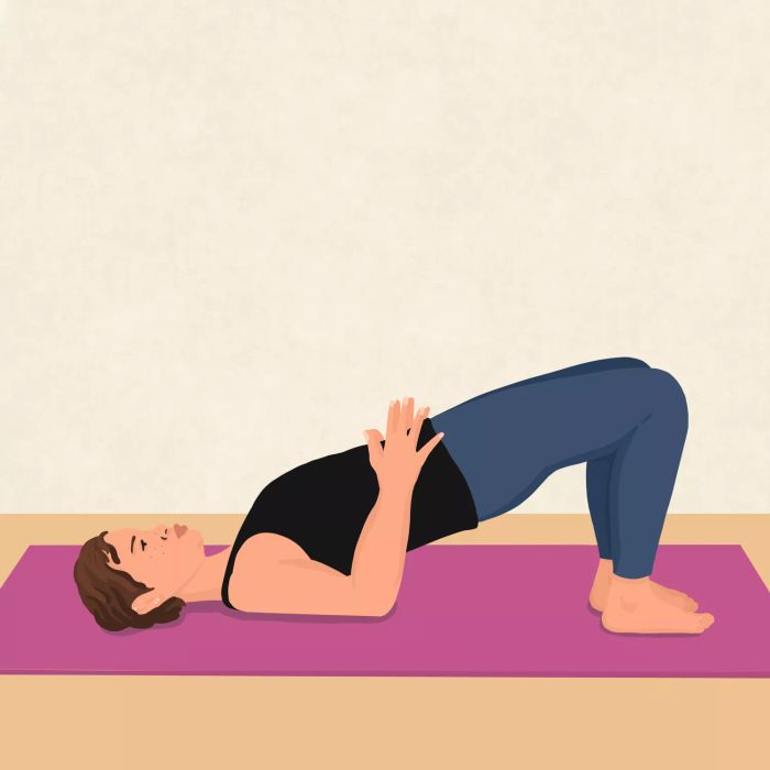 Pelvic Floor Exercise: Glute Bridge pose to build pelvic floor strength.