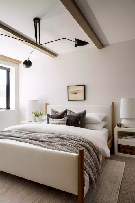 Neutral bedroom with cozy, layered bedding