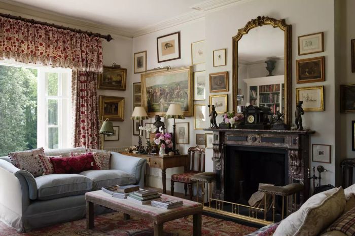French-inspired living room with a large antique mirror above the mantel