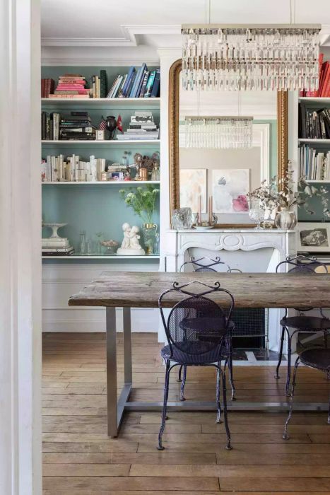 Parisian dining room featuring a fireplace and mantle