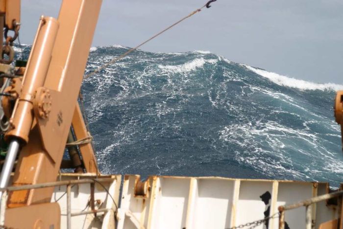 A massive wave towering behind the NOAA ship ‘Delaware II’ in the Atlantic Ocean, 2005.