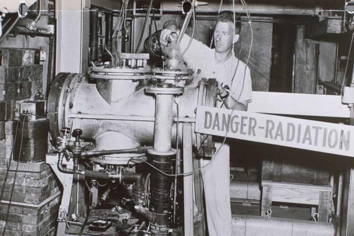 Technician at Oak Ridge laboratory handling radioactive material