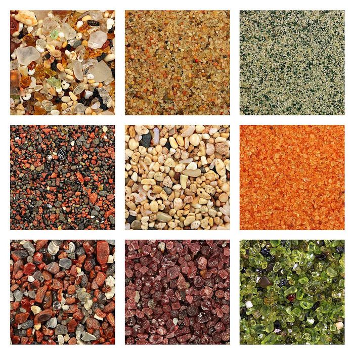 An assortment of colored sands, including quartz sand from Estonia (upper right), coral sand from Molokai, HI (middle), and olivine sand from Pa.