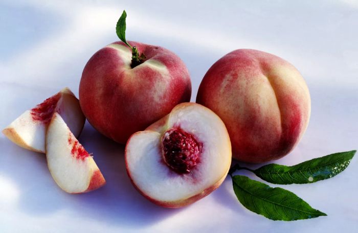 Whole and Cut White Peaches