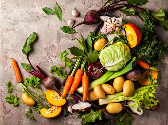 A selection of fall vegetables displayed on a table