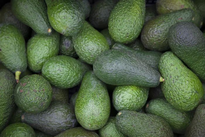 A stack of ripe avocados