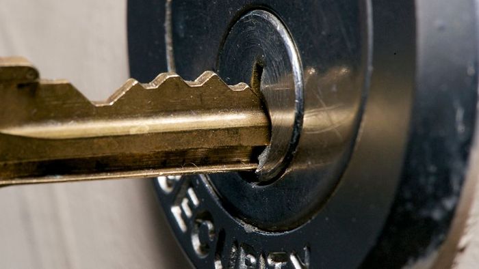 A master key unlocking a door lock