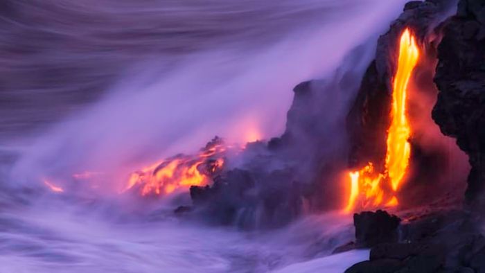 Lava flowing into the ocean at Kilauea, Hawaii.