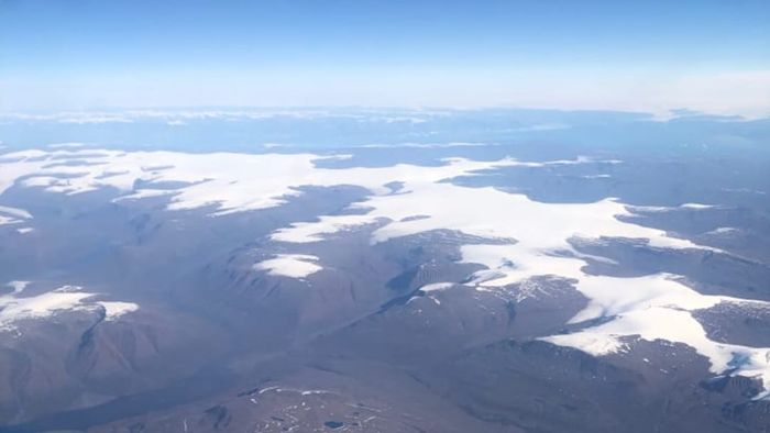 The west coast of Greenland appeared to be carved and shaped by the relentless forces of wind and ice.