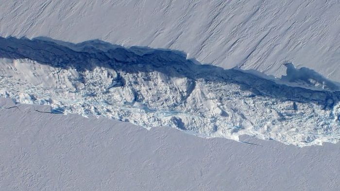 NASA’s aerial shot of Pine Island Glacier reveals a vast crack in the ice, filled with large ice boulders.
