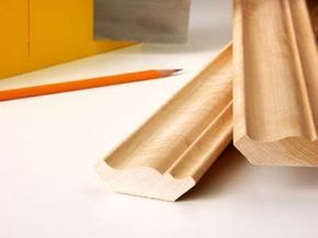 A thin cut of maple molding in a shallow frame.