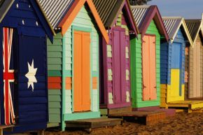 Vibrantly painted beach huts