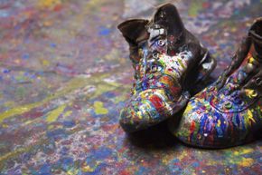 Boots covered in paint splatters.