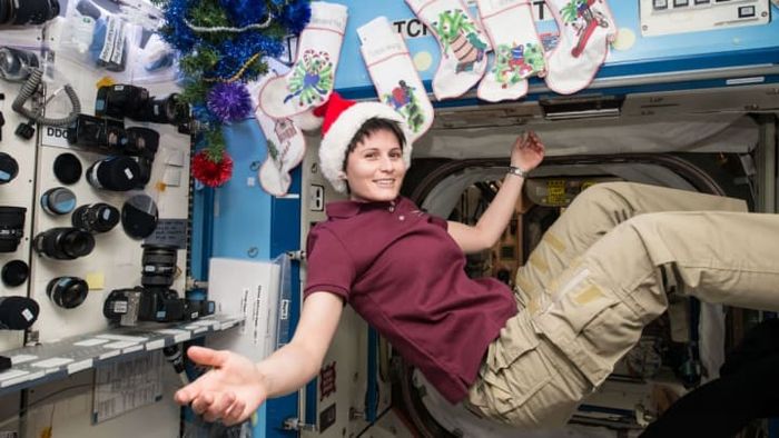 On December 25, 2014, Expedition 42 Flight Engineer Samantha Cristoforetti of the European Space Agency takes a moment to unwind aboard the International Space Station.