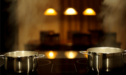 Two pans cooking on an induction cooktop