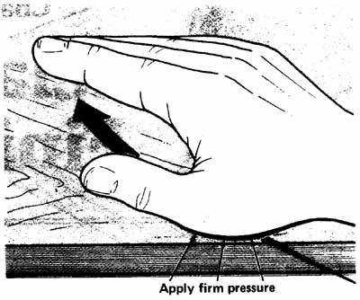 Illustration showing oil being applied by hand to wooden furniture.