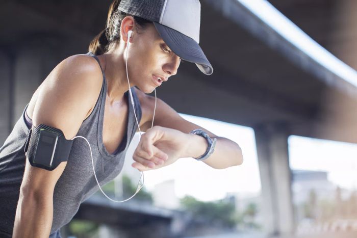 Woman in a baseball cap exercising