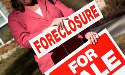 Displaying foreclosure notice alongside for sale sign