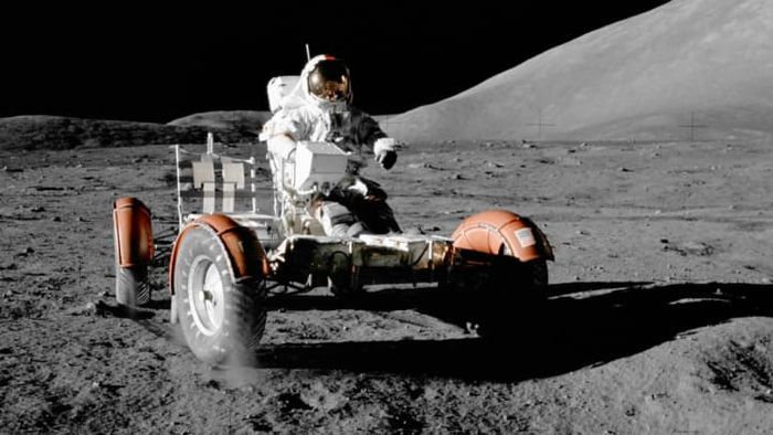 Astronaut Eugene A. Cernan operates the Lunar Roving Vehicle during the Apollo 17 mission.