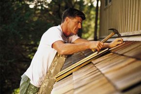 A man fixing the roof