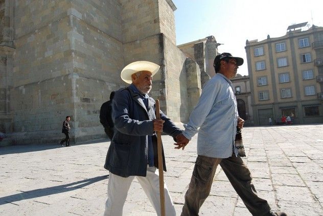 Assisting_blind_man_walking_mexico