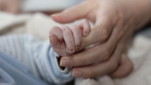 Parenting--Holding-Hands-Baby--Stock-Xchng