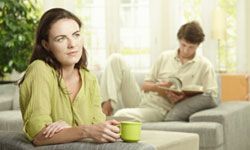 A couple with a woman pondering thoughtfully