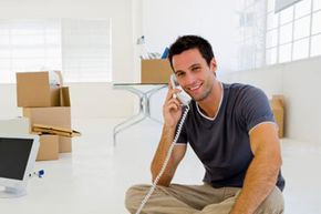 Man on phone in an empty home