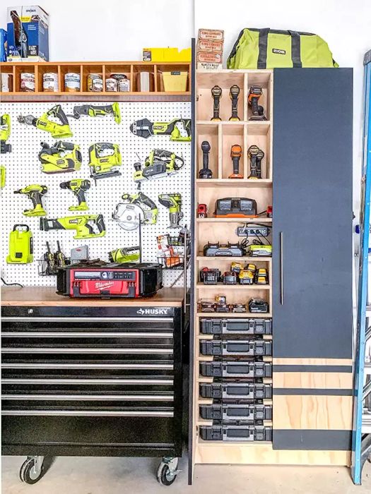 Pegboard Display with Power Tools, Storage Cubbies, and Pull-Out Drawers in Garage