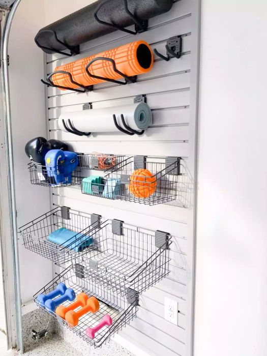 Wall-Mounted Storage in Basement for Workout Equipment, Yoga Mats, and Hand Weights